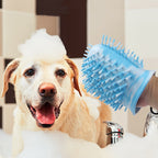 Dog being bathed with a blue pet grooming brush in a bathroom setting.