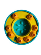 Colorful circular puzzle toy with blue center and orange outer rings on a white background